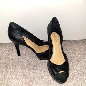 Gently worn. Black peep toe heel.